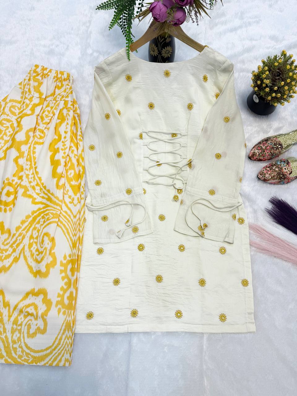 Radiant Ivory White Short Kurti Adorned with Sunshine Yellow Embroidery Paired with a Flowy Patterned Farshi Salwar